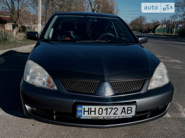 Сірий Міцубісі Lancer, об'ємом двигуна 1.6 л та пробігом 305 тис. км за 5200 $, фото 1 на Automoto.ua