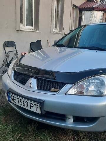 Сірий Міцубісі Lancer, об'ємом двигуна 1.58 л та пробігом 238 тис. км за 5000 $, фото 12 на Automoto.ua