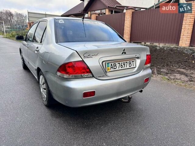 Сірий Міцубісі Lancer, об'ємом двигуна 1.58 л та пробігом 333 тис. км за 2999 $, фото 4 на Automoto.ua