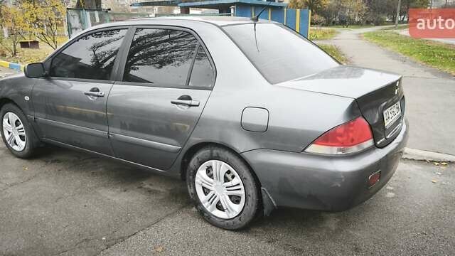 Серый Мицубиси Лансер, объемом двигателя 1.6 л и пробегом 263 тыс. км за 3800 $, фото 2 на Automoto.ua