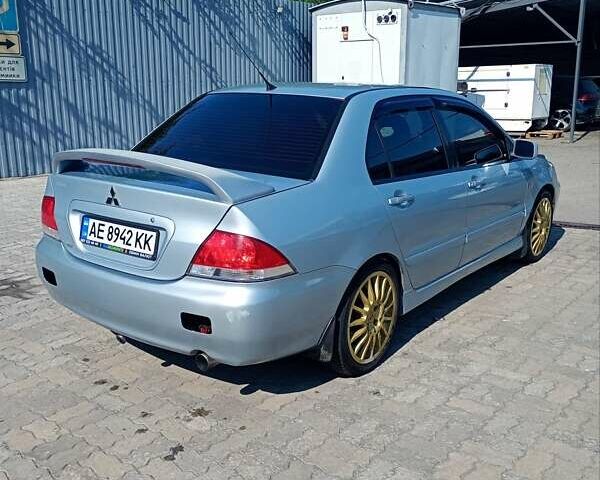 Сірий Міцубісі Lancer, об'ємом двигуна 1.58 л та пробігом 265 тис. км за 2900 $, фото 3 на Automoto.ua