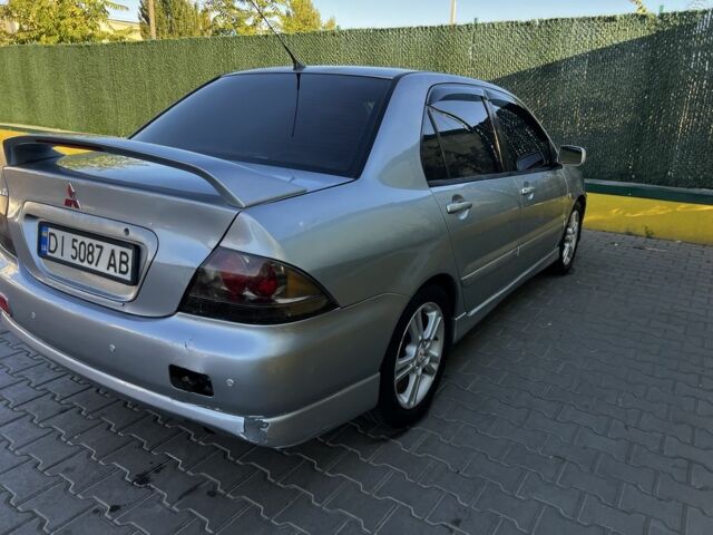 Сірий Міцубісі Lancer, об'ємом двигуна 2 л та пробігом 192 тис. км за 5400 $, фото 3 на Automoto.ua