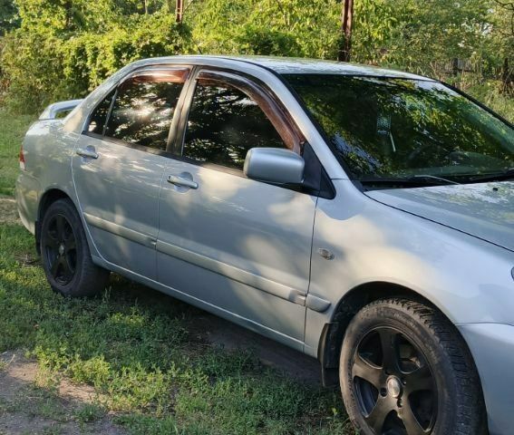 Сірий Міцубісі Lancer, об'ємом двигуна 1.6 л та пробігом 258 тис. км за 4100 $, фото 2 на Automoto.ua