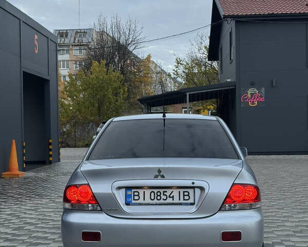 Серый Мицубиси Лансер, объемом двигателя 1.6 л и пробегом 269 тыс. км за 4000 $, фото 4 на Automoto.ua