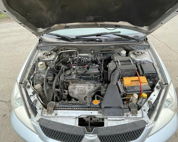 Сірий Міцубісі Lancer, об'ємом двигуна 1.58 л та пробігом 430 тис. км за 2550 $, фото 7 на Automoto.ua