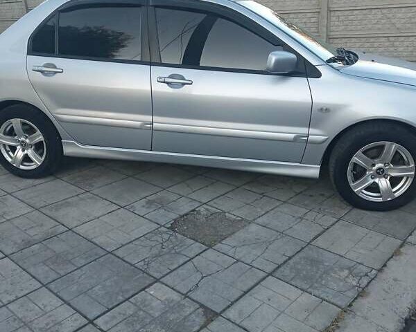 Мицубиси Лансер 2006 в Каменское - Днепродзержинск на Automoto.ua Серый Мицубиси Лансер, объемом двигателя 1.58 л и пробегом 238 тыс. км за 5400 $, фото 9 на Automoto.ua