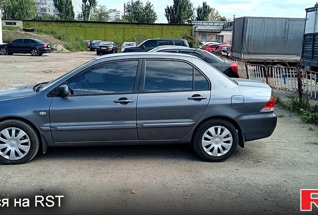 Серый Мицубиси Лансер, объемом двигателя 1.6 л и пробегом 275 тыс. км за 4700 $, фото 1 на Automoto.ua