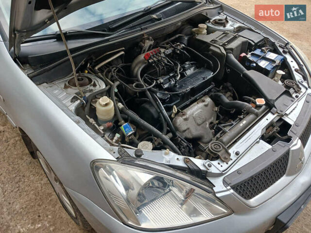 Серый Мицубиси Лансер, объемом двигателя 1.58 л и пробегом 215 тыс. км за 4000 $, фото 10 на Automoto.ua