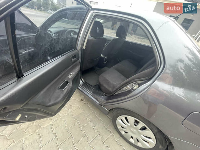 Сірий Міцубісі Lancer, об'ємом двигуна 1.58 л та пробігом 162 тис. км за 4650 $, фото 14 на Automoto.ua