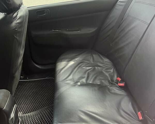 Сірий Міцубісі Lancer, об'ємом двигуна 1.58 л та пробігом 197 тис. км за 3450 $, фото 3 на Automoto.ua