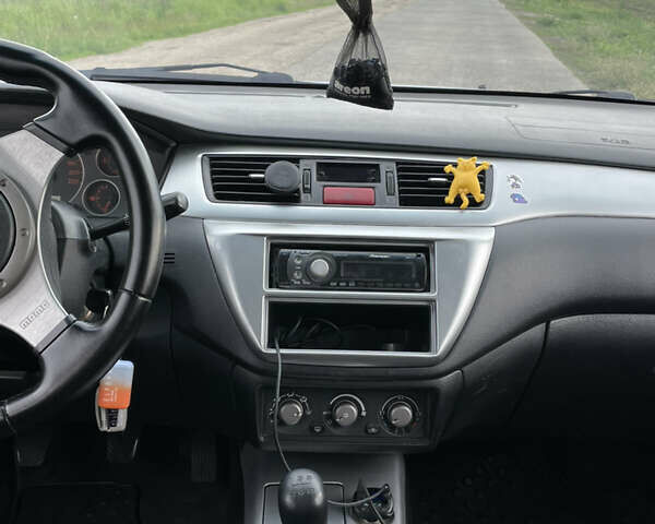 Сірий Міцубісі Lancer, об'ємом двигуна 2 л та пробігом 319 тис. км за 4199 $, фото 11 на Automoto.ua
