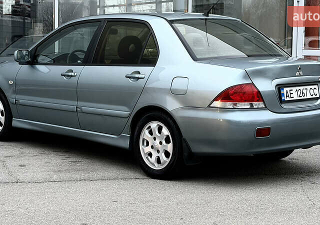 Сірий Міцубісі Lancer, об'ємом двигуна 1.58 л та пробігом 275 тис. км за 4600 $, фото 3 на Automoto.ua