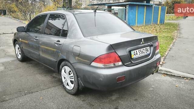 Серый Мицубиси Лансер, объемом двигателя 1.6 л и пробегом 263 тыс. км за 3800 $, фото 11 на Automoto.ua