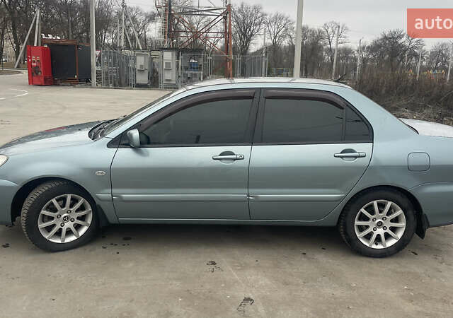 Сірий Міцубісі Lancer, об'ємом двигуна 1.58 л та пробігом 267 тис. км за 5300 $, фото 5 на Automoto.ua