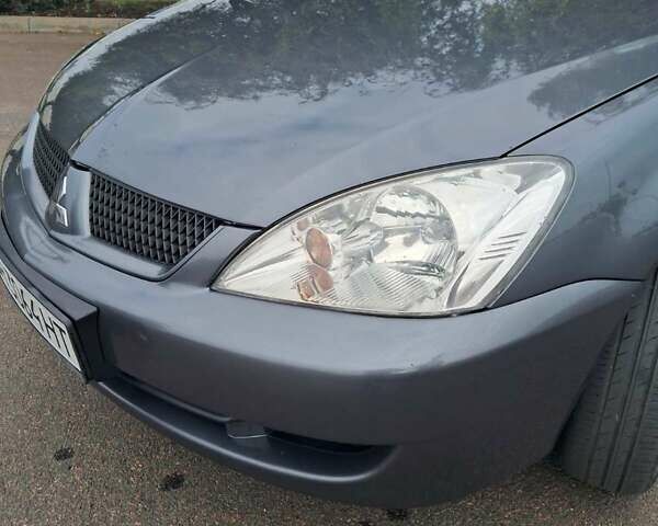 Сірий Міцубісі Lancer, об'ємом двигуна 1.6 л та пробігом 229 тис. км за 4900 $, фото 23 на Automoto.ua