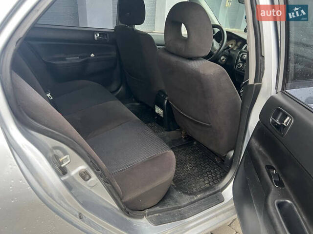 Сірий Міцубісі Lancer, об'ємом двигуна 1.58 л та пробігом 333 тис. км за 2450 $, фото 19 на Automoto.ua