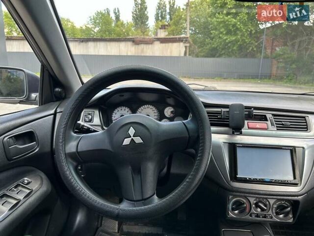 Сірий Міцубісі Lancer, об'ємом двигуна 1.58 л та пробігом 160 тис. км за 4600 $, фото 13 на Automoto.ua