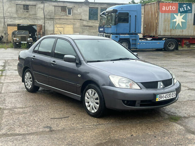 Серый Мицубиси Лансер, объемом двигателя 1.6 л и пробегом 193 тыс. км за 4700 $, фото 7 на Automoto.ua