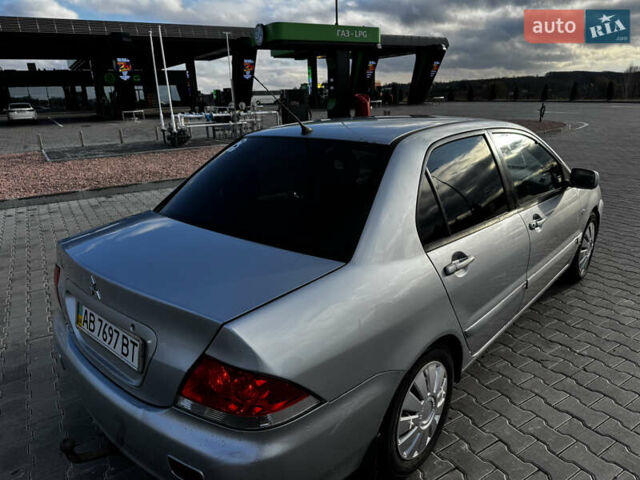 Сірий Міцубісі Lancer, об'ємом двигуна 1.58 л та пробігом 333 тис. км за 2999 $, фото 4 на Automoto.ua
