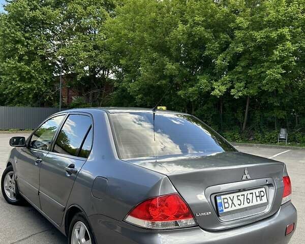 Сірий Міцубісі Lancer, об'ємом двигуна 1.58 л та пробігом 160 тис. км за 4600 $, фото 17 на Automoto.ua