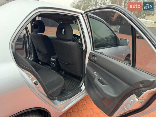 Серый Мицубиси Лансер, объемом двигателя 1.6 л и пробегом 242 тыс. км за 4300 $, фото 12 на Automoto.ua