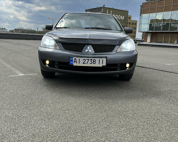 Сірий Міцубісі Lancer, об'ємом двигуна 1.6 л та пробігом 260 тис. км за 4998 $, фото 13 на Automoto.ua