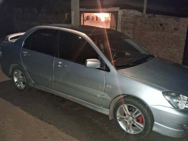 Сірий Міцубісі Lancer, об'ємом двигуна 2 л та пробігом 1000 тис. км за 3600 $, фото 2 на Automoto.ua