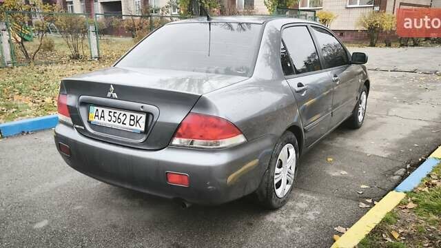 Серый Мицубиси Лансер, объемом двигателя 1.6 л и пробегом 263 тыс. км за 3800 $, фото 8 на Automoto.ua