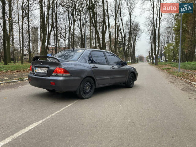 Сірий Міцубісі Lancer, об'ємом двигуна 1.6 л та пробігом 222 тис. км за 4900 $, фото 2 на Automoto.ua