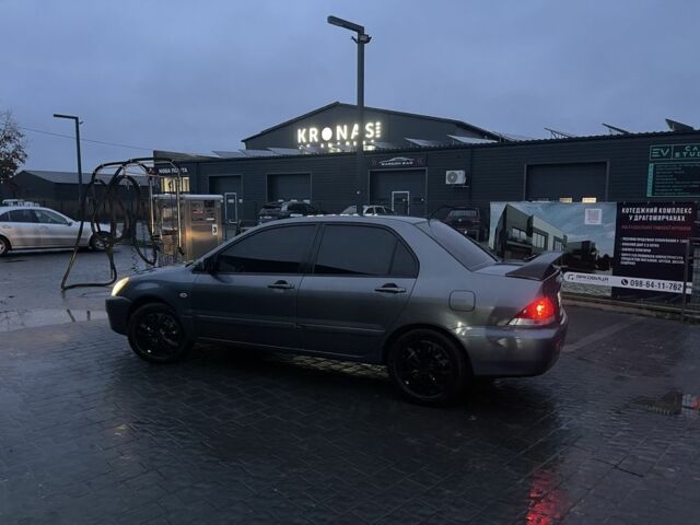 Серый Мицубиси Лансер, объемом двигателя 1.6 л и пробегом 213 тыс. км за 4450 $, фото 3 на Automoto.ua