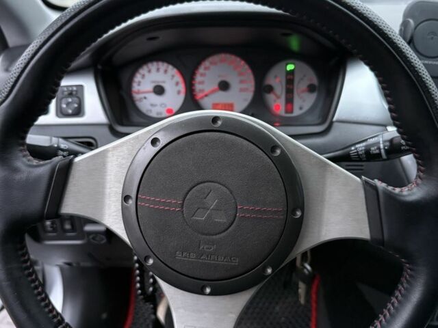 Серый Мицубиси Лансер, объемом двигателя 2 л и пробегом 256 тыс. км за 7000 $, фото 2 на Automoto.ua