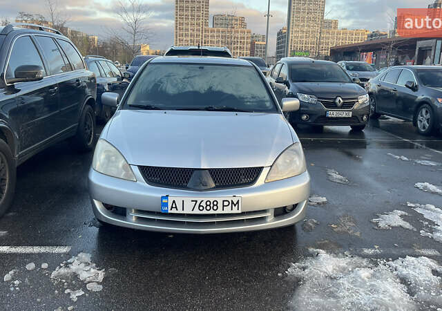 Серый Мицубиси Лансер, объемом двигателя 2 л и пробегом 307 тыс. км за 3999 $, фото 8 на Automoto.ua