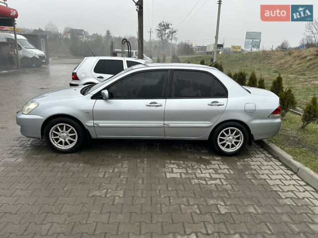 Сірий Міцубісі Lancer, об'ємом двигуна 1.6 л та пробігом 223 тис. км за 3900 $, фото 2 на Automoto.ua