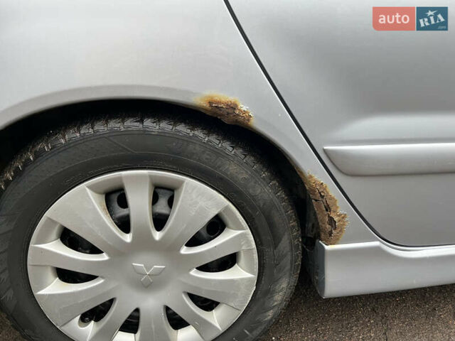 Сірий Міцубісі Lancer, об'ємом двигуна 1.58 л та пробігом 308 тис. км за 3700 $, фото 17 на Automoto.ua