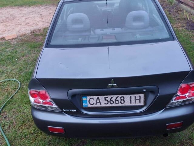 Сірий Міцубісі Lancer, об'ємом двигуна 1.6 л та пробігом 190 тис. км за 3500 $, фото 1 на Automoto.ua