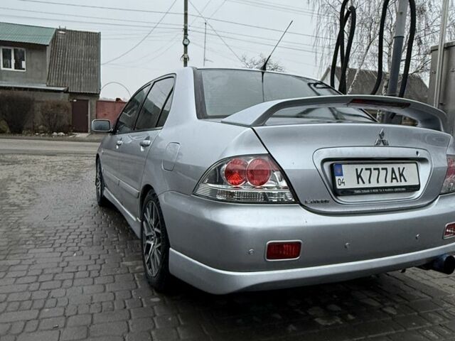 Серый Мицубиси Лансер, объемом двигателя 2 л и пробегом 256 тыс. км за 7000 $, фото 5 на Automoto.ua