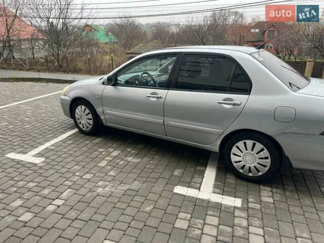 Серый Мицубиси Лансер, объемом двигателя 1.6 л и пробегом 333 тыс. км за 2800 $, фото 7 на Automoto.ua