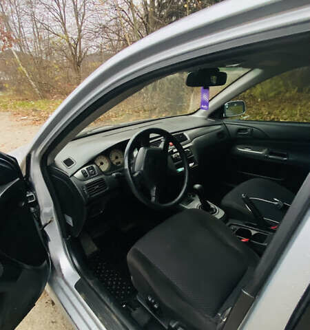 Серый Мицубиси Лансер, объемом двигателя 1.6 л и пробегом 253 тыс. км за 2850 $, фото 14 на Automoto.ua