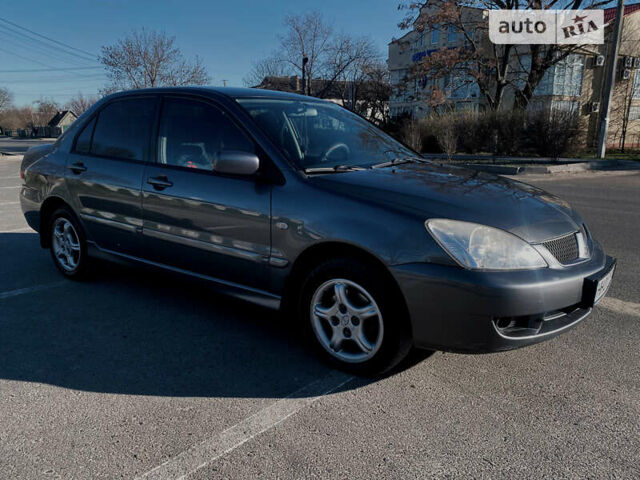 Сірий Міцубісі Lancer, об'ємом двигуна 1.6 л та пробігом 305 тис. км за 5200 $, фото 2 на Automoto.ua