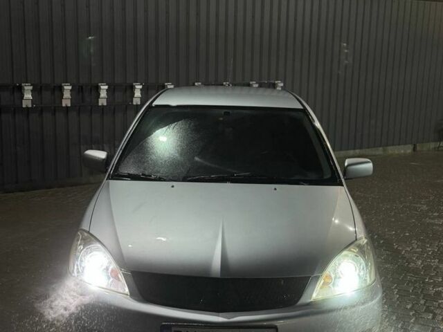 Серый Мицубиси Лансер, объемом двигателя 1.6 л и пробегом 330 тыс. км за 3200 $, фото 1 на Automoto.ua