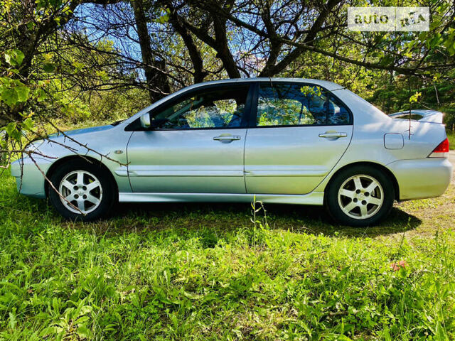 Сірий Міцубісі Lancer, об'ємом двигуна 1.6 л та пробігом 203 тис. км за 5000 $, фото 4 на Automoto.ua