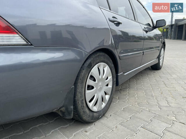Сірий Міцубісі Lancer, об'ємом двигуна 1.58 л та пробігом 162 тис. км за 4650 $, фото 7 на Automoto.ua