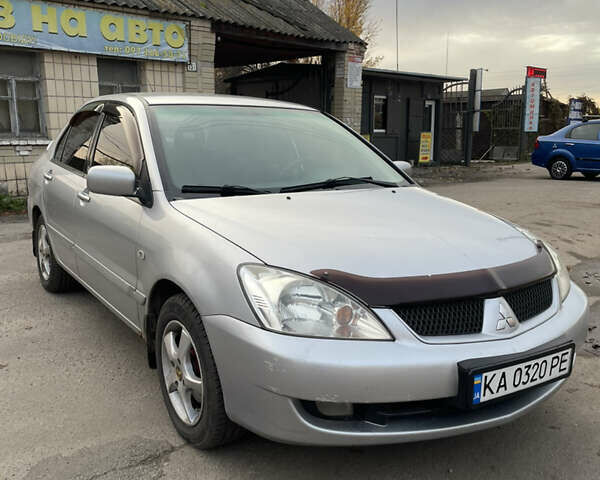 Сірий Міцубісі Lancer, об'ємом двигуна 1.58 л та пробігом 430 тис. км за 2550 $, фото 1 на Automoto.ua