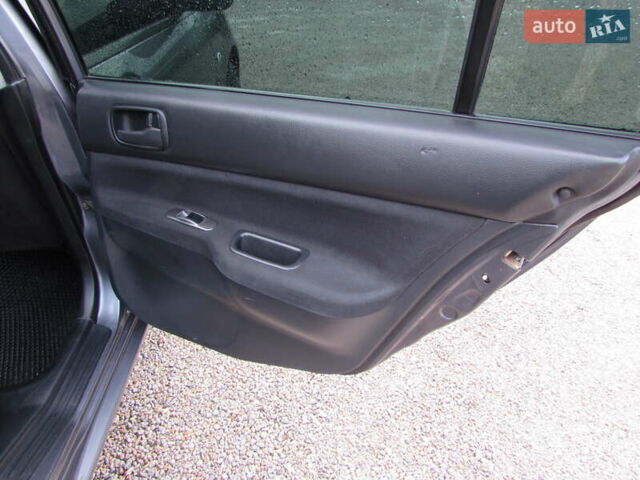 Серый Мицубиси Лансер, объемом двигателя 1.58 л и пробегом 300 тыс. км за 3600 $, фото 12 на Automoto.ua