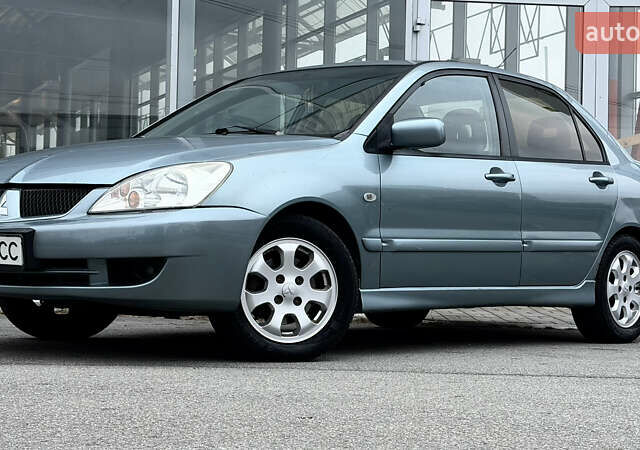 Сірий Міцубісі Lancer, об'ємом двигуна 1.58 л та пробігом 275 тис. км за 4600 $, фото 9 на Automoto.ua