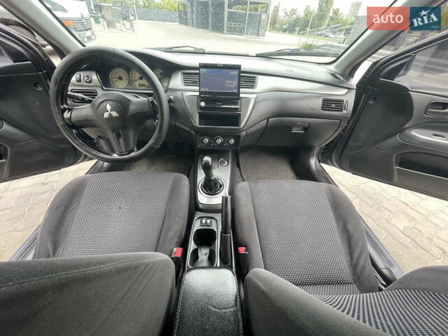Сірий Міцубісі Lancer, об'ємом двигуна 1.58 л та пробігом 162 тис. км за 4650 $, фото 12 на Automoto.ua