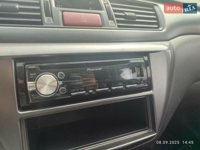 Сірий Міцубісі Lancer, об'ємом двигуна 1.6 л та пробігом 242 тис. км за 4900 $, фото 26 на Automoto.ua
