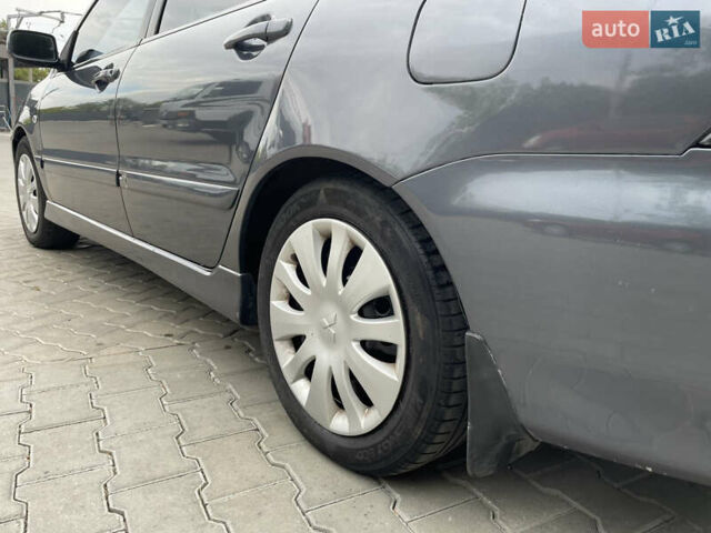 Сірий Міцубісі Lancer, об'ємом двигуна 1.58 л та пробігом 162 тис. км за 4650 $, фото 6 на Automoto.ua