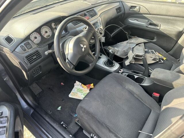Сірий Міцубісі Lancer, об'ємом двигуна 1.6 л та пробігом 200 тис. км за 1150 $, фото 5 на Automoto.ua