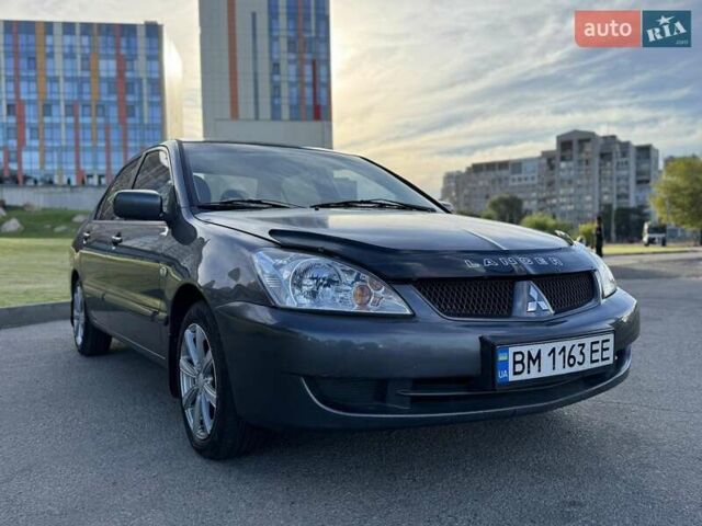 Сірий Міцубісі Lancer, об'ємом двигуна 1.58 л та пробігом 267 тис. км за 3999 $, фото 1 на Automoto.ua